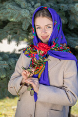Portrait of a young beautiful woman with a scarf on her head
