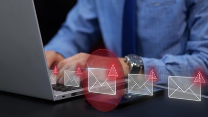 Digital security attack through phishing email on businessman laptop. Warning of data threat and cyber risk