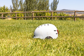 A white helmet on the green grass background