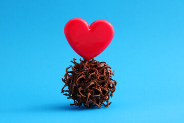 Love overcomes any conflict, heart on a spiky ball