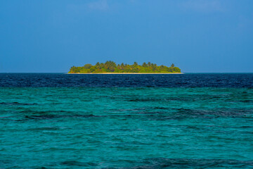 A small island at the background. Tropical island beach landscape exotic shore coast. Summer vacation, holiday amazing nature. Relax paradise, Maldives.