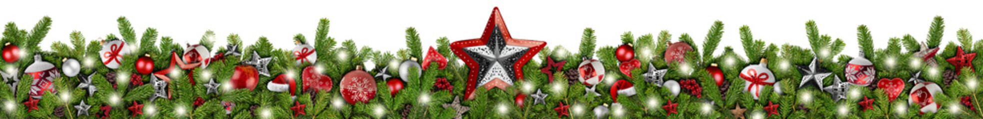 WOnderful christmas garland super wide panorama banner with fir branches red silver stars lights and baubles xmas russtic traditional natural tree decoration isolated white background