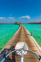 Bicycle basket in the frame. Tropical island beach landscape exotic shore coast. Tranquil closeup calm sea water waves. Summer vacation, holiday amazing nature. Relax paradise, Maldives.