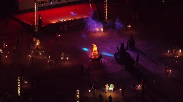A bonfire party taking place in the dark night