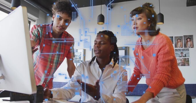 Collaborating professionals in casual attire reviewing holographic data on monitor in modern office - Powered by Adobe