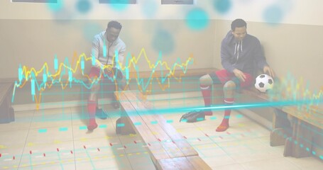 Sitting two men tying cleats and holding soccer ball in sports locker room, with chart overlay