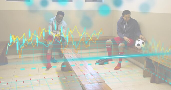 Sitting two men tying cleats and holding soccer ball in sports locker room, with chart overlay