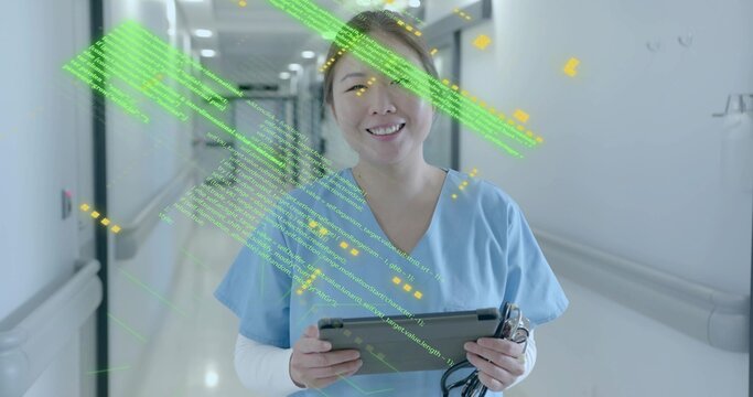 Smiling nurse in blue scrubs holding tablet, stethoscope in hospital hallway, with code overlay