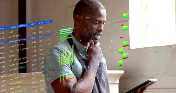Man wearing grey apron holding tablet analyzing floating data overlays in workshop, copy space