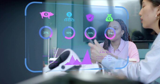 Three professionals meeting in boardroom reviewing financial overlay with VR headset and tablet