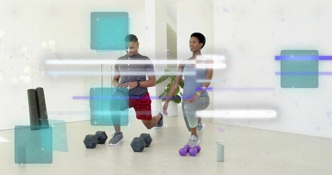 Performing forward lunges woman in gray, man in red in studio with dumbbells and digital overlays