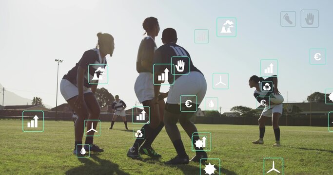 crouching rugby squad wearing jerseys white shorts socks and cleats on grass, showcasing data icons - Powered by Adobe