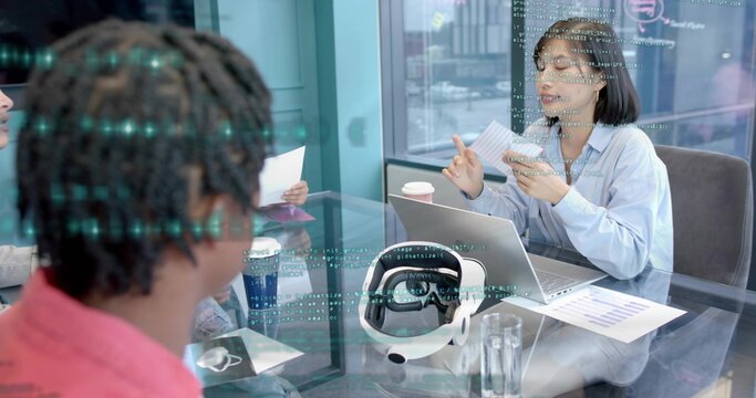 Presenting Korean woman wearing light blue shirt speaking and gesturing at glass table, VR headset - Powered by Adobe
