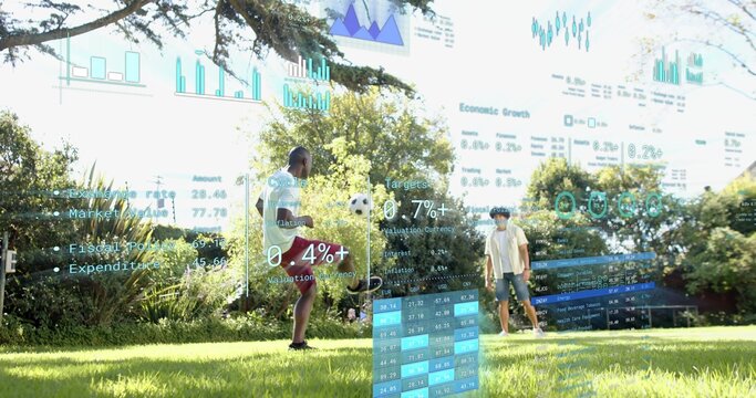 Juggling two men in shorts kicking soccer ball on park lawn, showing AR finance charts