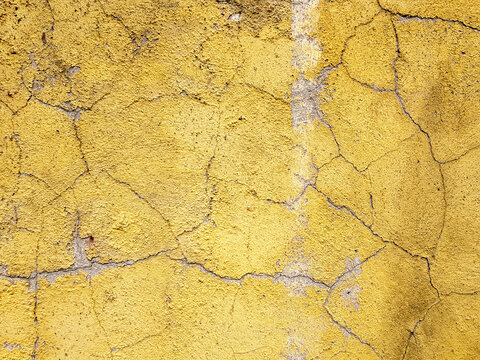 Old grunge wall surface yellow wall.