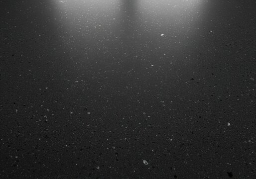 Deep charcoal gray quartz stone countertop texture with reflective mica specks