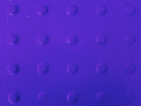 Violet abstract background with convex dots.