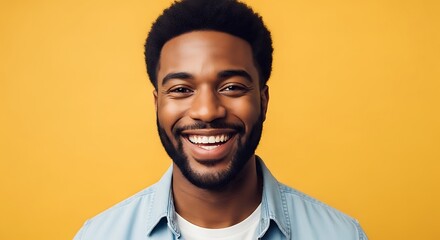 Obraz premium Portrait of a handsome african american man with a bright smile, exuding confidence and positivity against a vibrant yellow backdrop