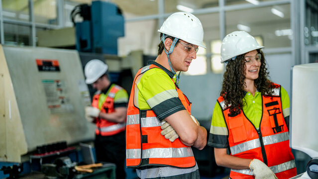A happy engineering team represents the future of work. They use an AI driven smart factory for advanced high tech manufacturing and supply chain optimization.