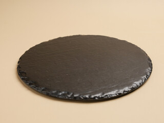 Empty black stone tray or cutting board 