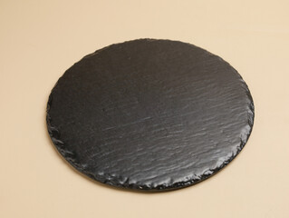Empty black stone tray or cutting board 