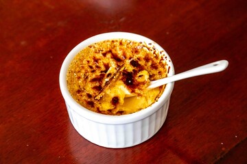 Classic Creme Brulee in a Ramekin with a Spoon