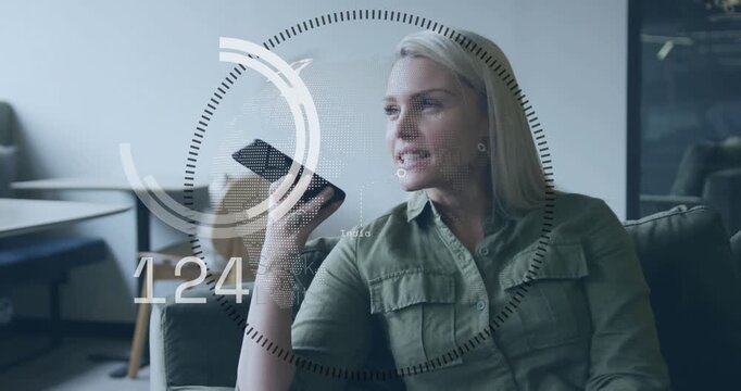 Woman raising phone and speaking on sofa, circular HUD expanding while receiving real-time numbers