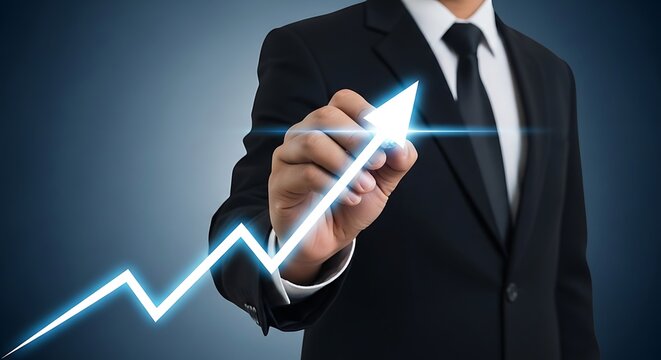 Businessman drawing an upward trend line indicating business growth and financial success