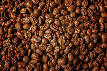 Roasted coffee beans creating a rich textured background