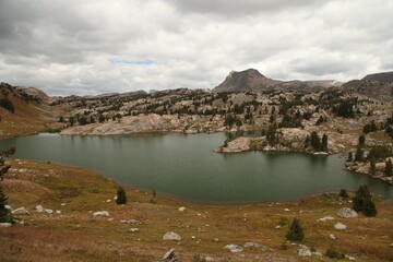 Alpine lake in Beartooth Mountains, Wyoming with view into Montana