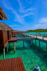 Summer vacation, holiday amazing nature. Relax paradise, Maldives. Tropical island beach landscape exotic shore coast. Tranquil closeup calm sea water waves with beautiful cabins.