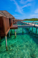 Summer vacation, holiday amazing nature. Relax paradise, Maldives. Tropical island beach landscape exotic shore coast. Tranquil closeup calm sea water waves with beautiful cabins.