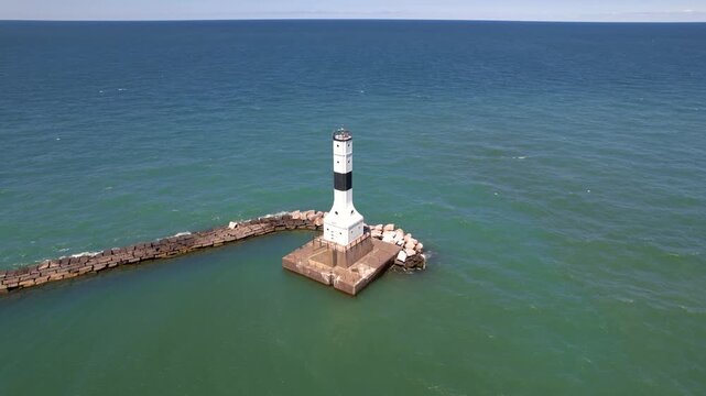 Aerial view of tall Conneaut West Breakwater Lighthouse in the middle of Lake Erie at Ohio, USA