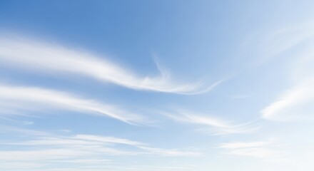 Obraz premium Bright Midday Blue Sky with Soft, Gently Drifting Clouds