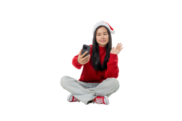 Girl smiles while video calling in winter attire, isolated, PNG