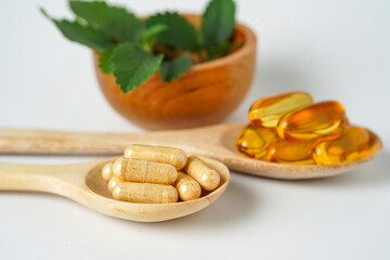 Alternative medicine herbal organic capsule vitamin E omega 3 fish oil drug herbs leaf natural