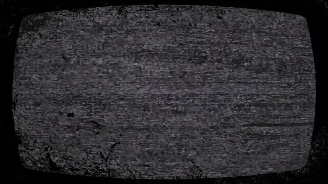 Textured black rectangle with digital aberrations, dark overlay. Some subtle purple/green spots
