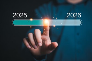 Finger touching progress bar from 2025 to 2026 loading