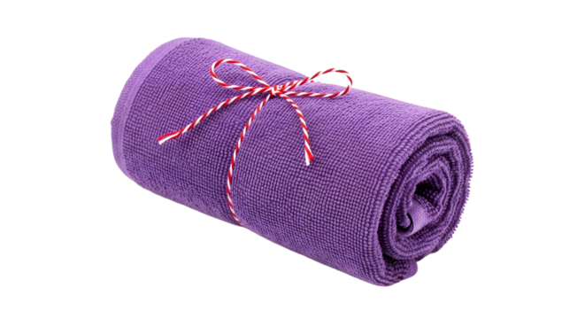 Gift - Rolled purple towel tied with red and white string on white background, perfect for spa, yoga, fitness or bath settings