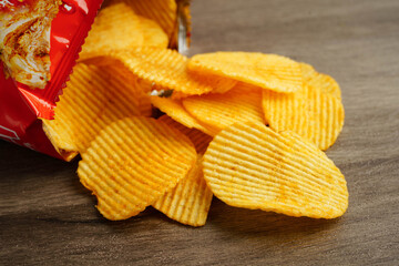 Potato chips , delicious BBQ seasoning spicy for crips, thin slice deep fried snack fast food.