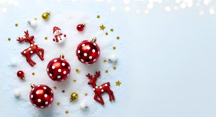 Red Christmas Ornaments with Reindeer and Snowman on Snowy Flat Lay
