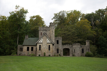 Fototapeta premium Stone Folly or Castle Ruins in Lush Green Forest Setting