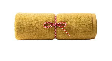 Gift - Rolled mustard yellow towel tied with red and white twine isolated on white background, perfect for spa and home decor