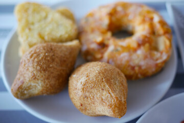 Tasty pastries served on a white plate for breakfast