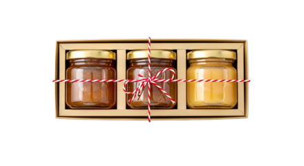 Gift - Set of three jars with different food spreads tied with red and white string in a gift box, perfect for gourmet gifting or special occasions