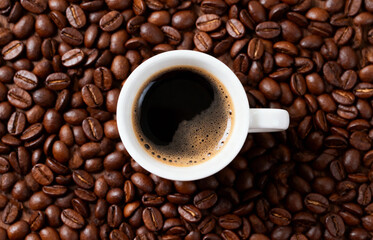 Hot Black Coffee with Brown Roasted Beans Close-up