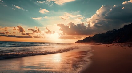 Fototapeta premium A vibrant sunset over a tranquil beach with golden sand and gentle waves lapping the shore.