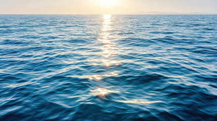 Fototapeta premium Calm sea surface reflecting sunset light creates peaceful atmosphere