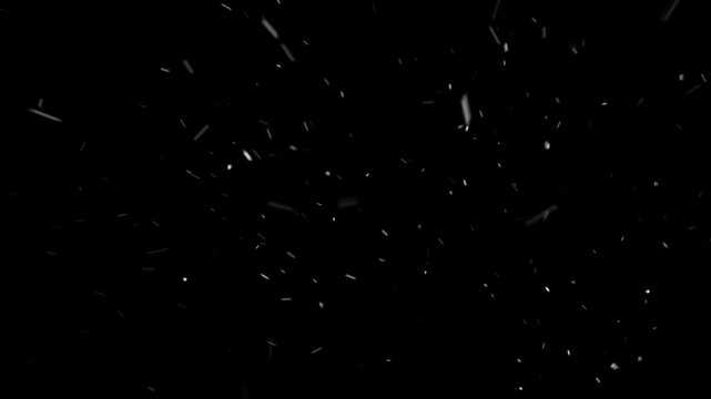 Realistic snow particles fall and drift quickly in wind on isolated black background. Perfect for intense winter storm scenes