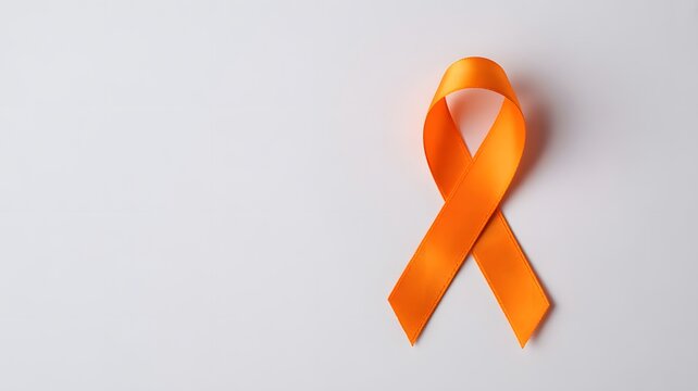 Orange ribbon on white background representing leukemia awareness, kidney cancer awareness, multiple sclerosis awareness, or selfinjury awareness isolated on white background